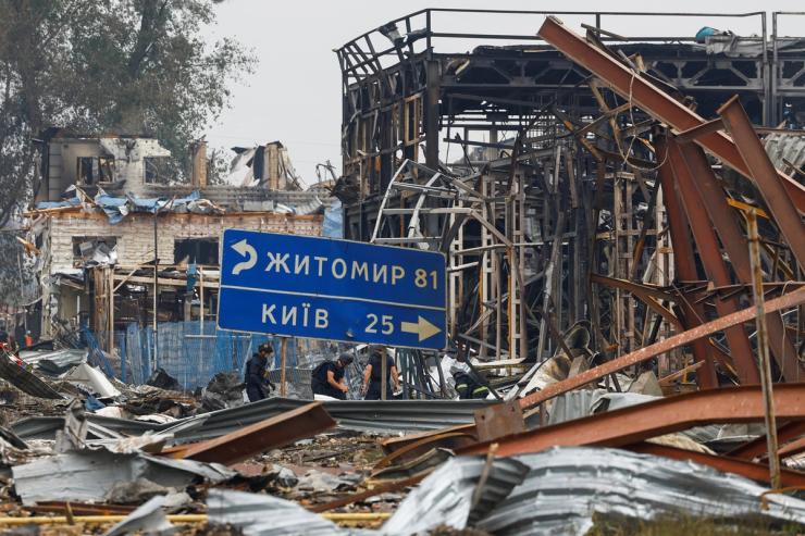 Rescuers work at the site of Friday evening’s Russian drone strikes, amid Russia’s attack on Ukraine