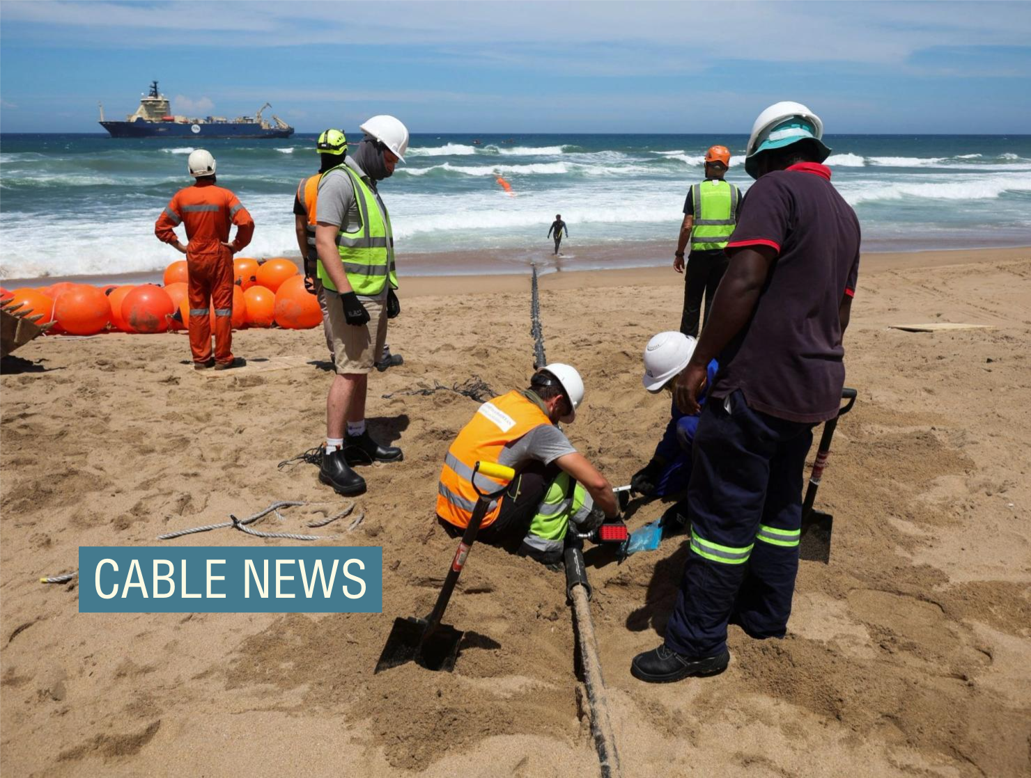 Workers install the 2Africa undersea cable on the beach in Amanzimtoti, South Africa