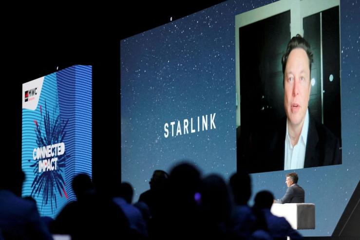Elon Musk speaking about Starlink at an event.