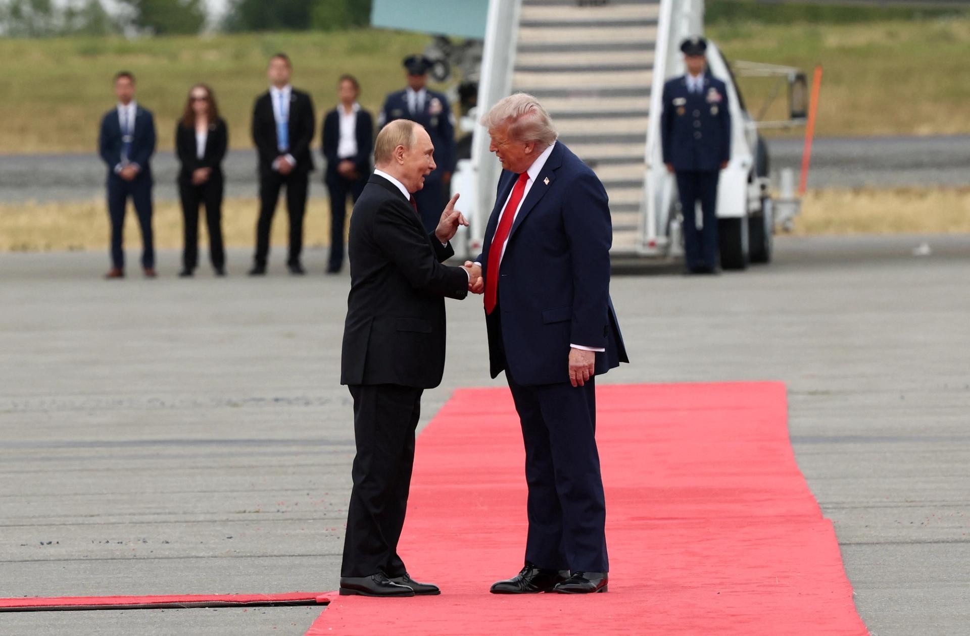 US President Donald Trump shakes hand with Russian President Vladimir Putin in Alaska.