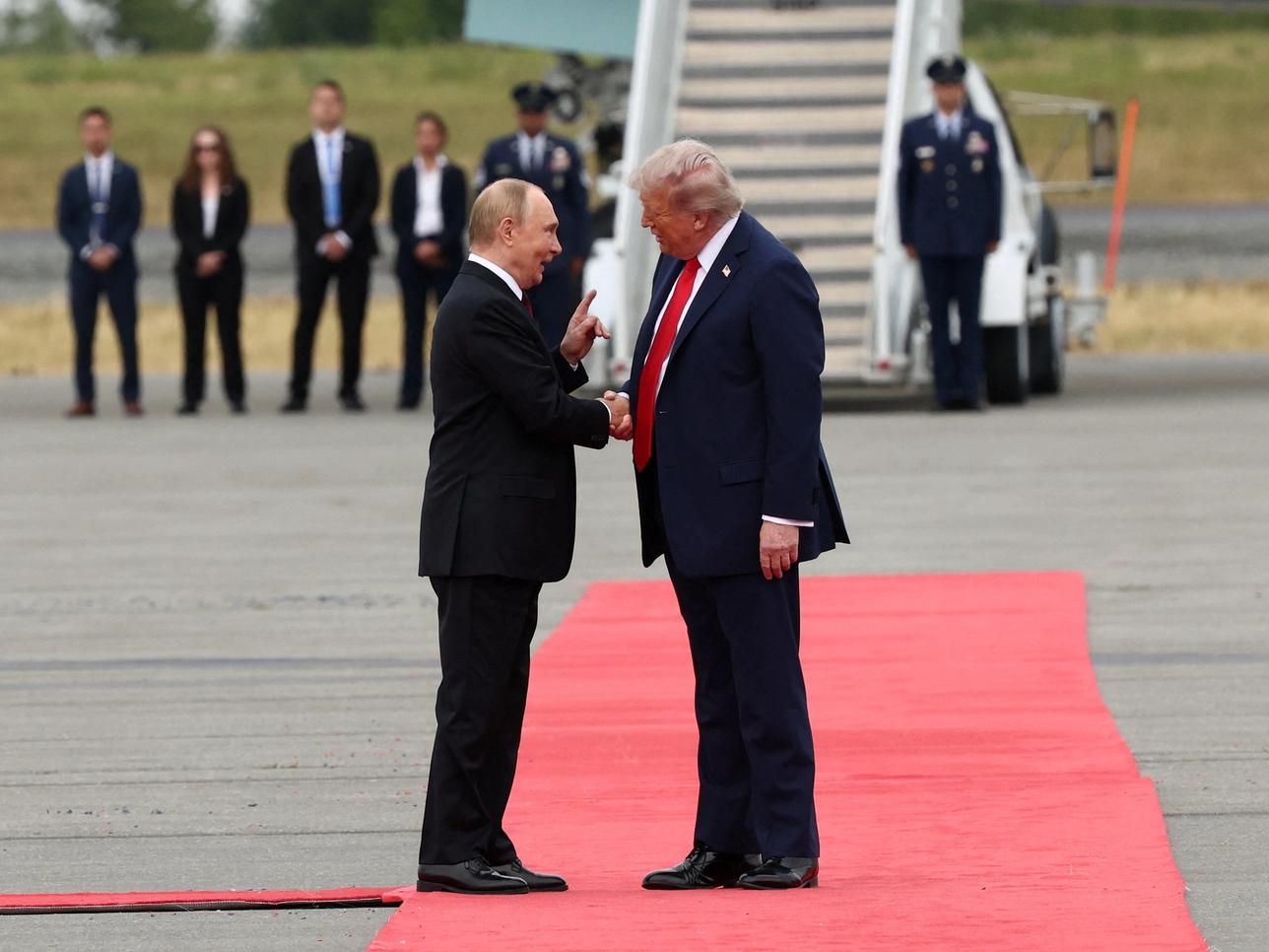 US President Donald Trump shakes hand with Russian President Vladimir Putin in Alaska.