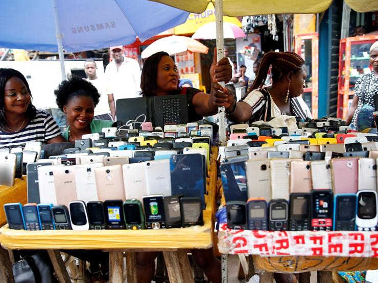 Women vendors display Nokia phone models for sale along with smartphones at the ‘Computer Village’ in Ikeja district in Nigeria’s commercial capital Lagos, Nigeria May 31, 2017.