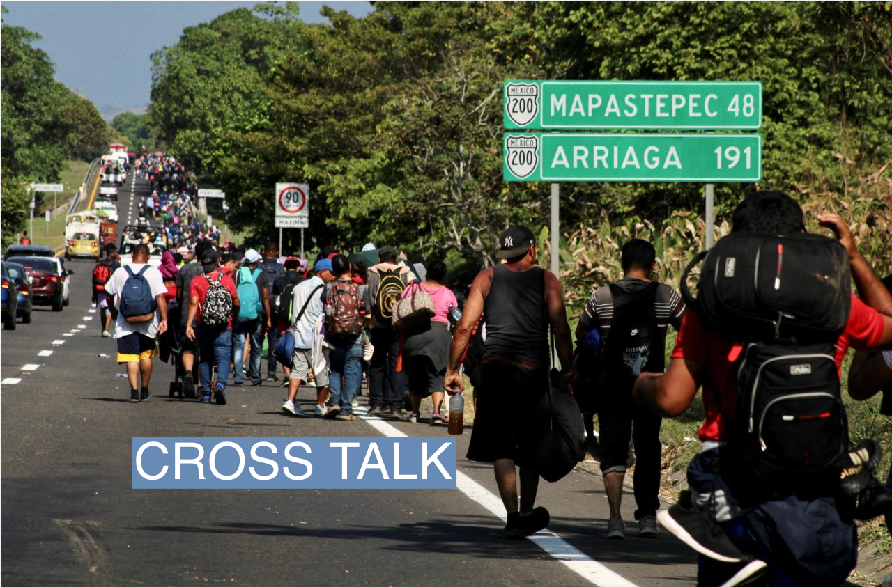Migrants walk in a caravan in the direction of the U.S. border, in Huixtla, Mexico December 26, 2023.