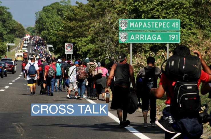 Migrants walk in a caravan in the direction of the U.S. border, in Huixtla, Mexico December 26, 2023.