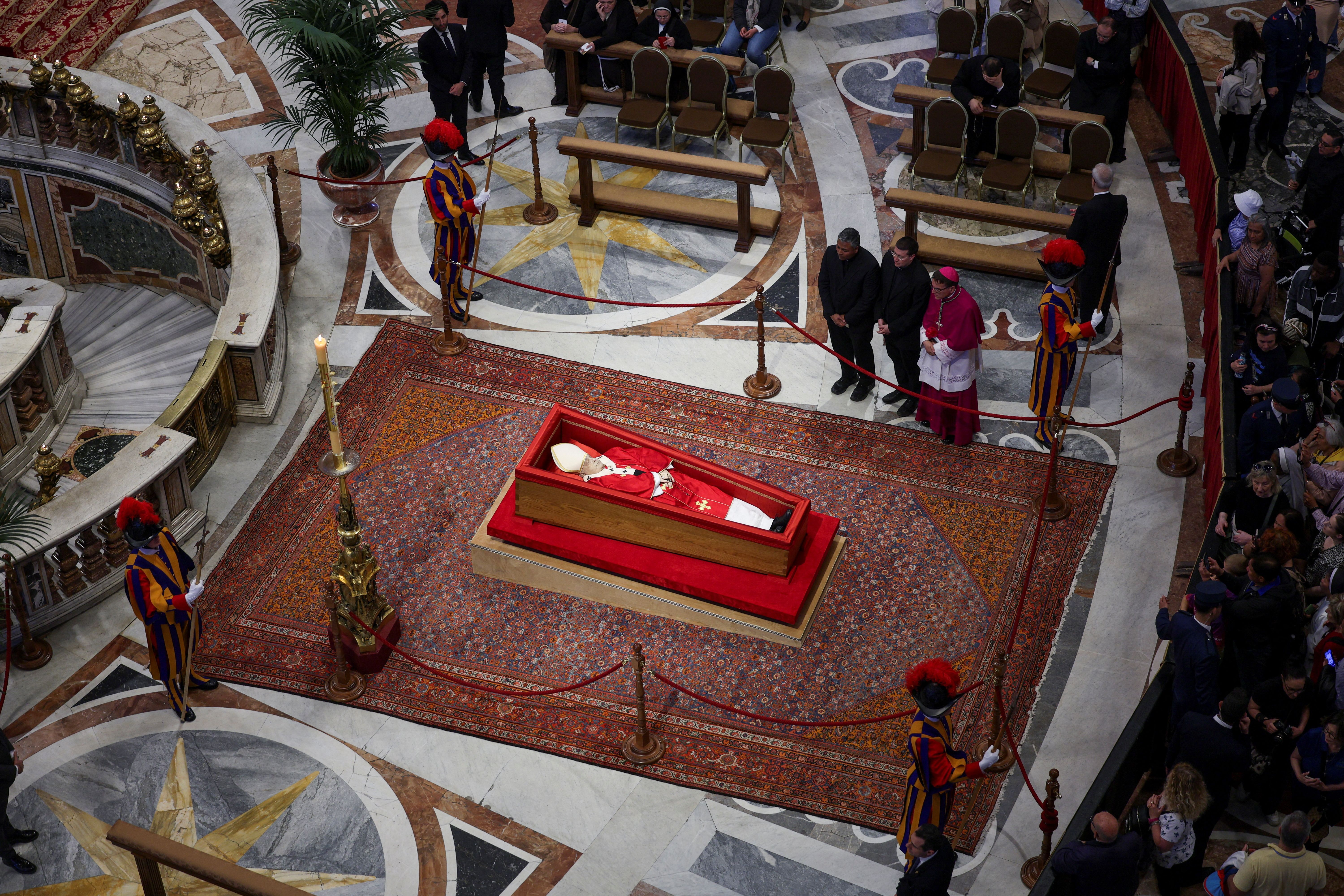 People pay respects as Pope Francis lies in state in St Peter’s Basilica, at the Vatican. 