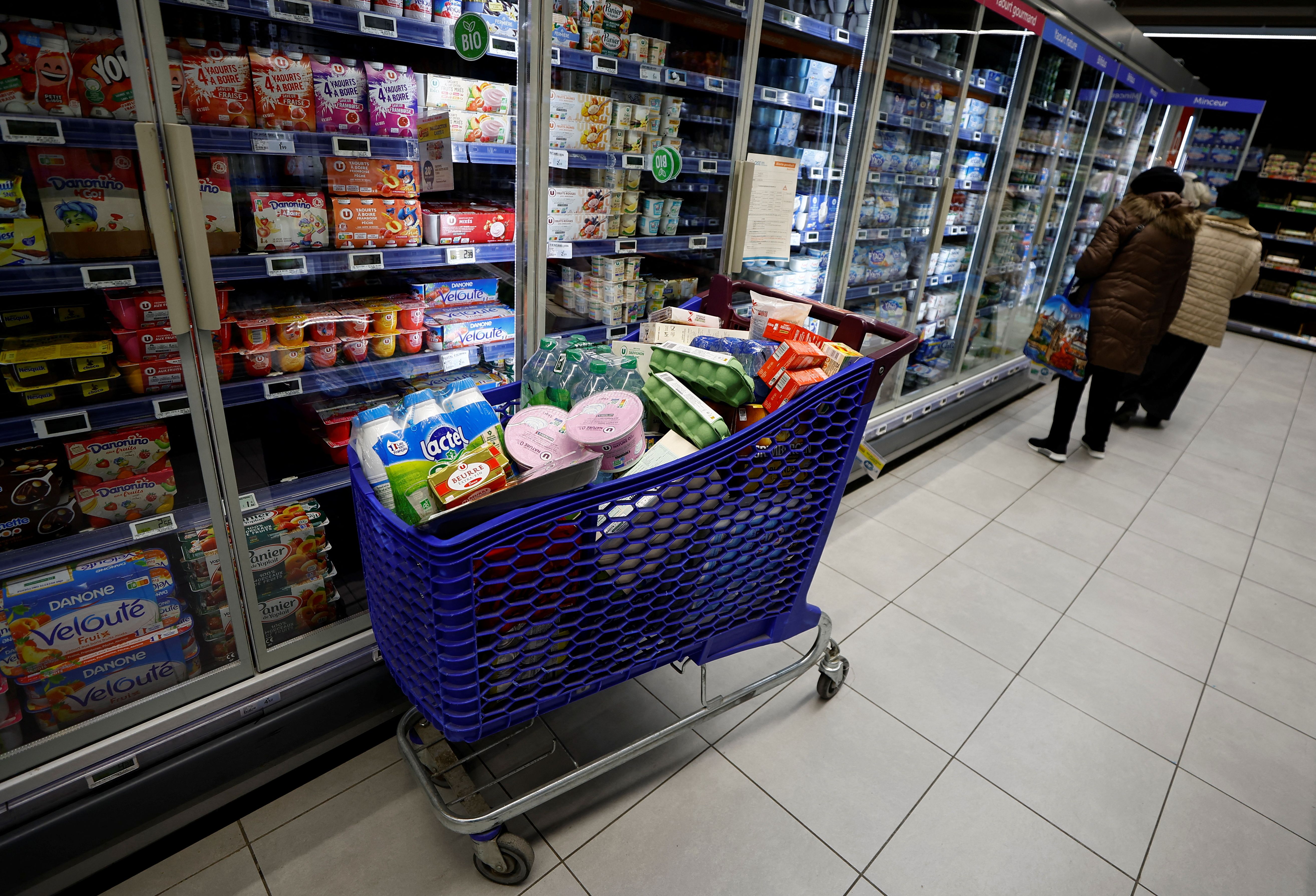 A trolley holding food in a supermarket.