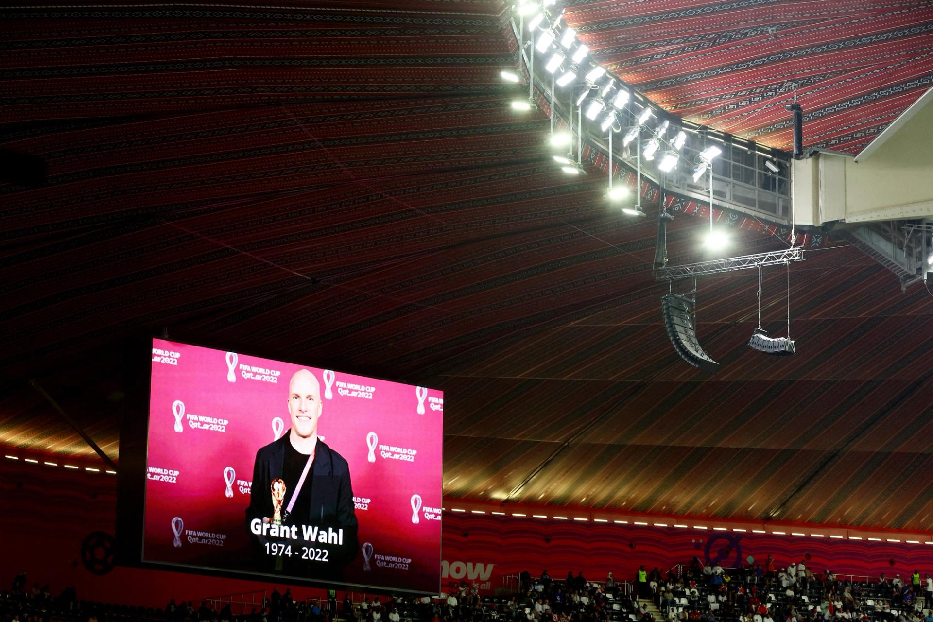 A big screen displays an image of American journalist Grant Wahl