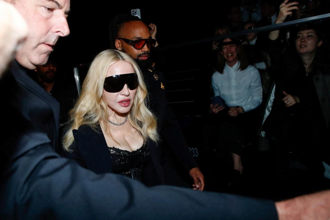 Madonna is seen with bodyguards