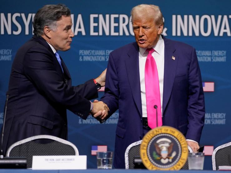 Donald Trump shakes hands with U.S. Senator Dave McCormick