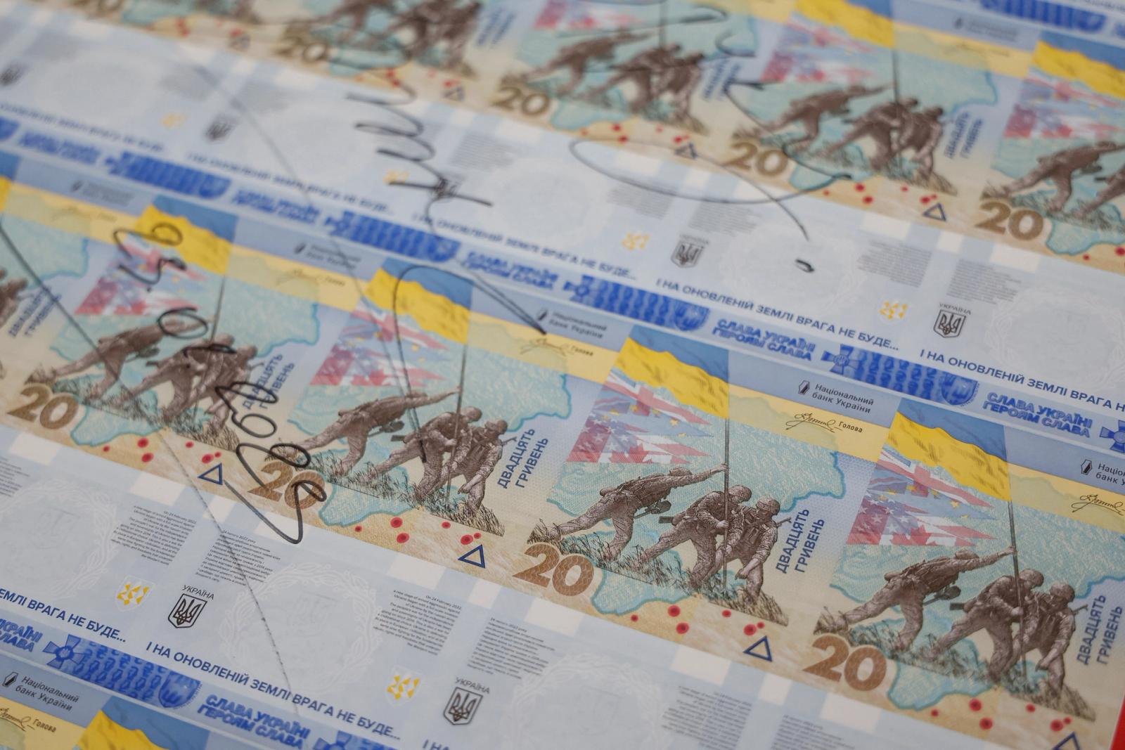 Banknotes dedicated to the first anniversary of Russia's invasion on Ukraine are seen during a presentation at the Ukrainian National Bank in Kyiv, Ukraine February 23, 2023. 