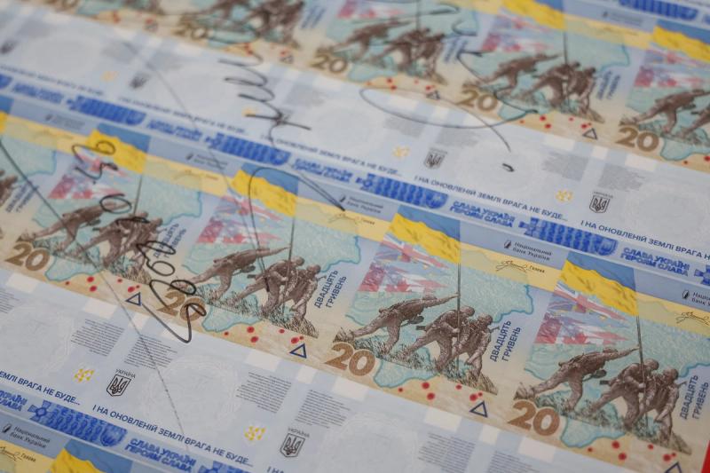Banknotes dedicated to the first anniversary of Russia’s invasion on Ukraine are seen during a presentation at the Ukrainian National Bank in Kyiv, Ukraine February 23, 2023.