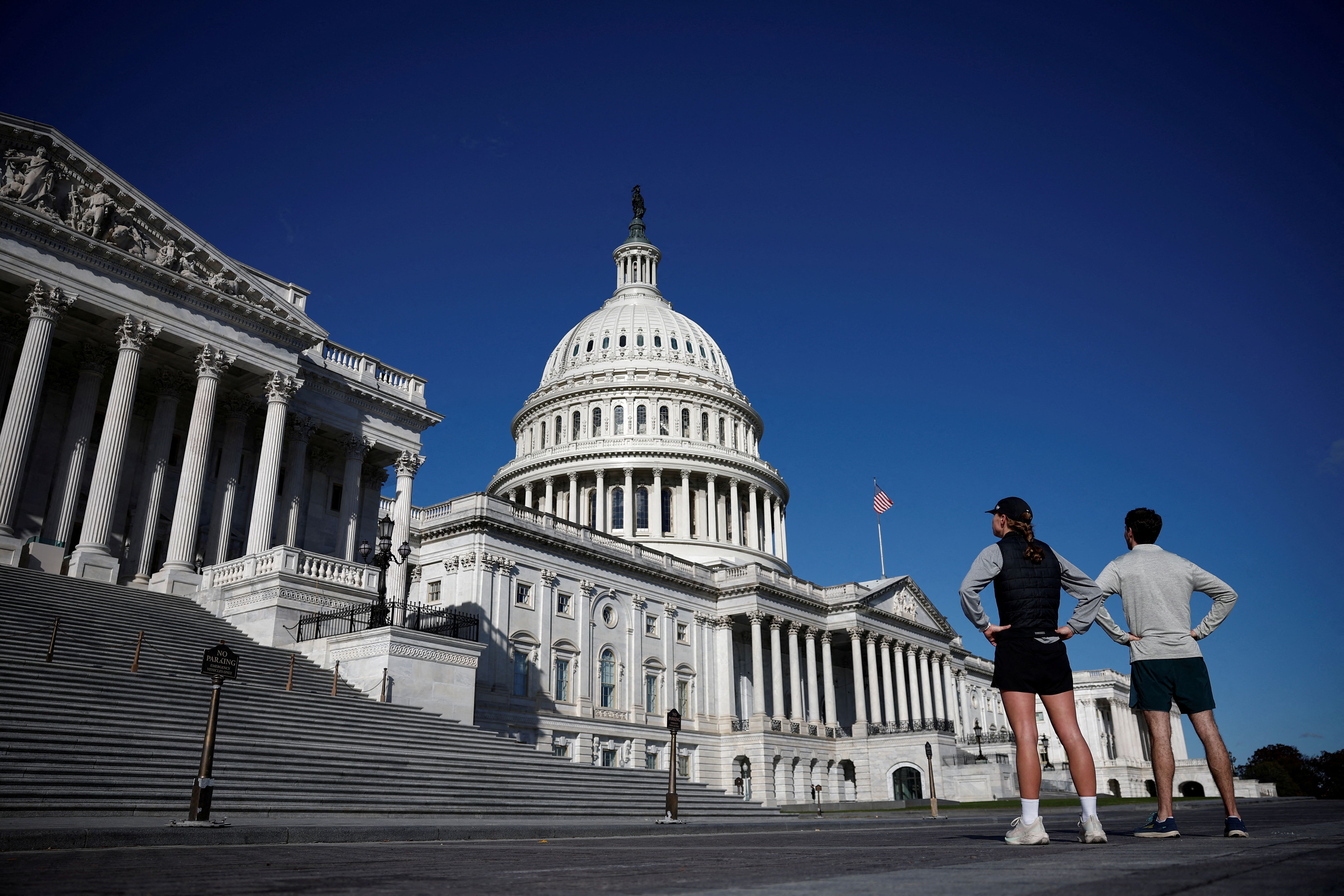  People look the US Capitol in Washington.