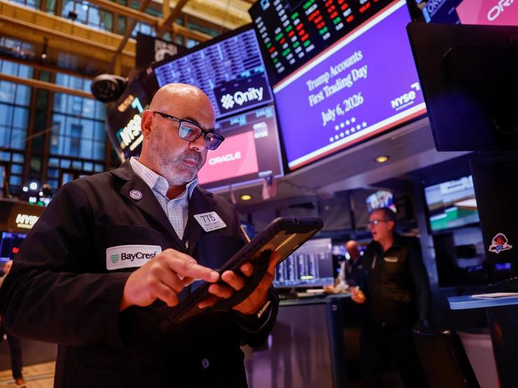 A trader works on the floor of the New York Stock Exchange