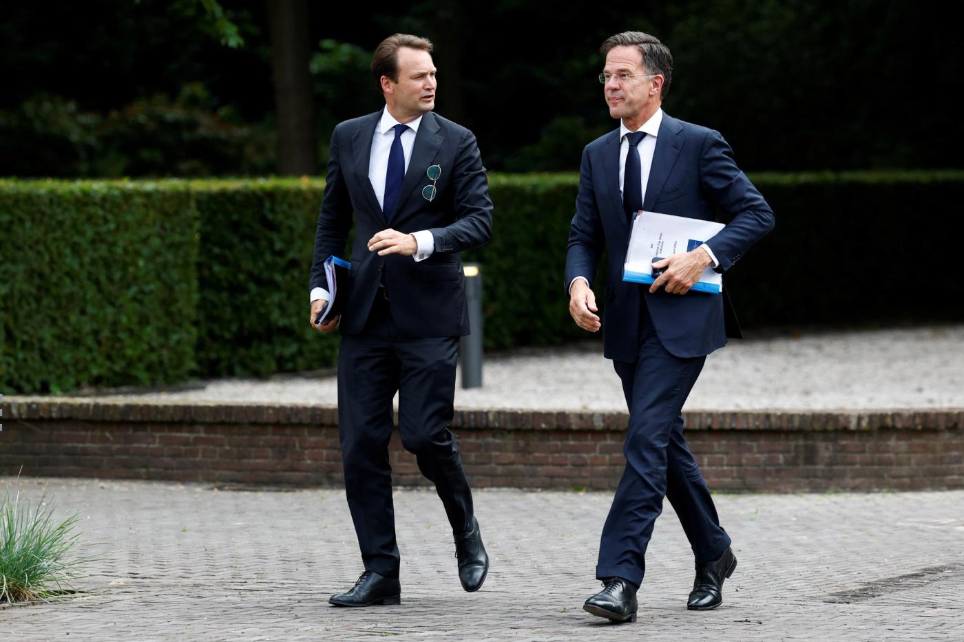 Dutch Prime Minister Mark Rutte walks with Foreign Affairs and Defence Advisor to the Prime Minister of the Netherlands, Geoffrey van Leeuwen.