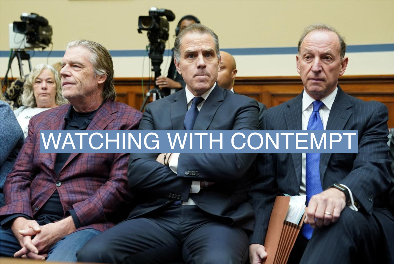 Hunter Biden sits with his attorney Abbe Lowell on Wednesday as he makes a surprise appearance at a House Oversight Committee vote on whether to hold him in contempt of Congress for failing to respond to a request to testify to the House last month. 