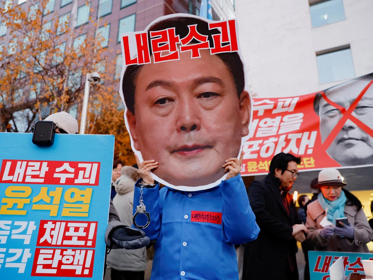 Protesters take part in a rally calling for the impeachment of South Korean President Yoon Suk Yeol, in Seoul.