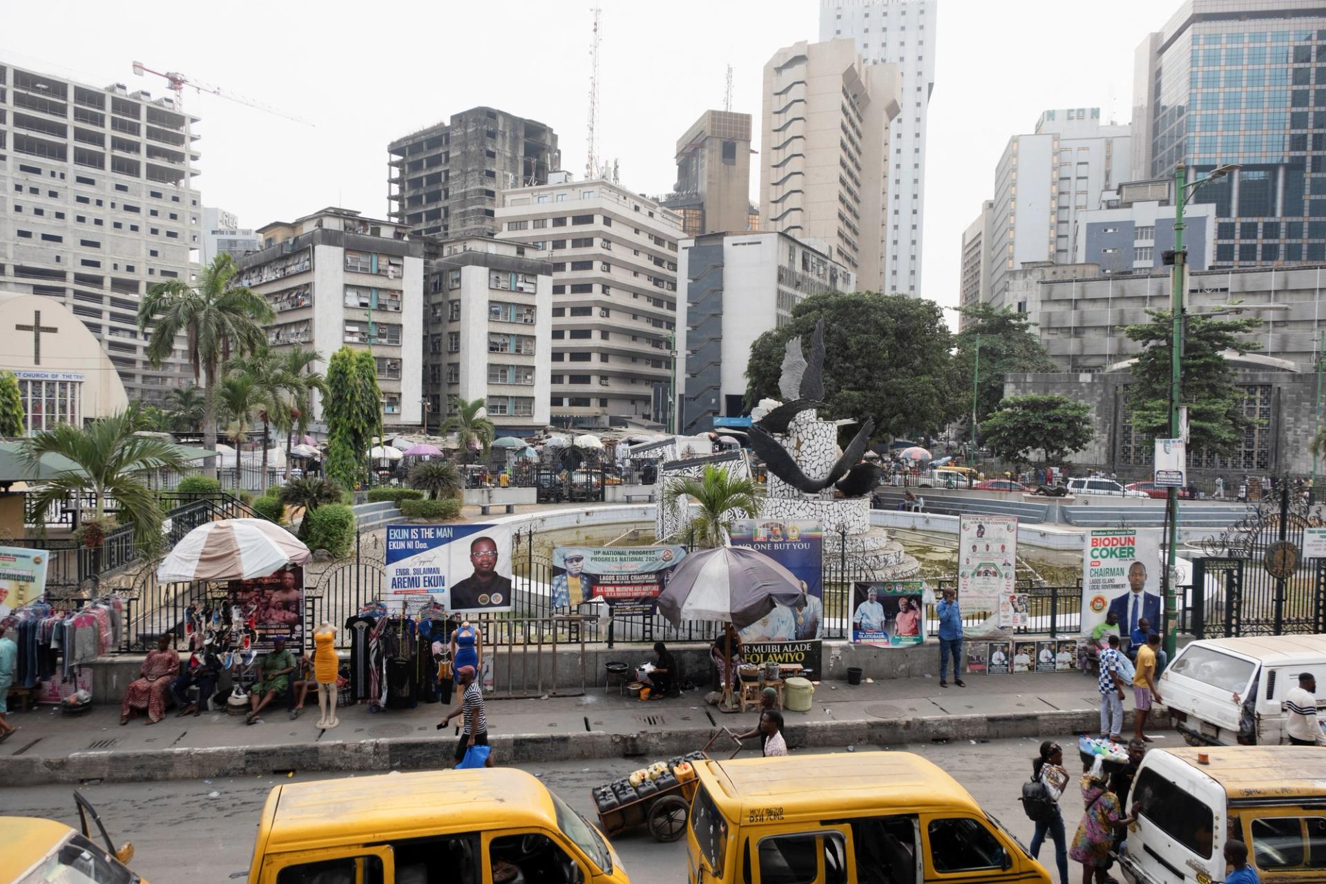 People walk on Broad Street, a commercial hub in Lagos, Nigeria.