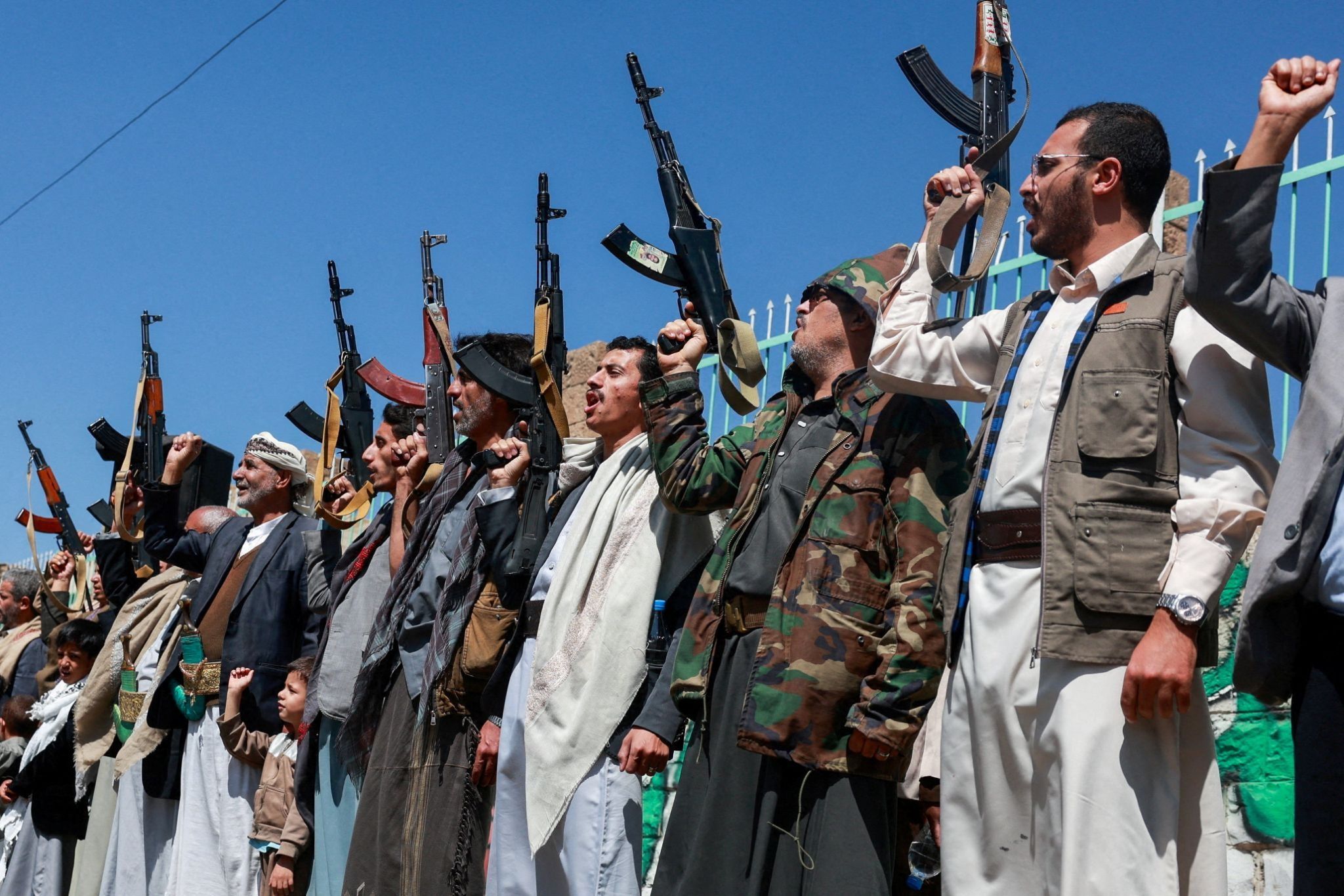 Houthi supporters carry weapons as they gather in solidarity with the movement as fighting intensifies across several fronts, in Sanaa, Yemen, Oct. 7, 2026.