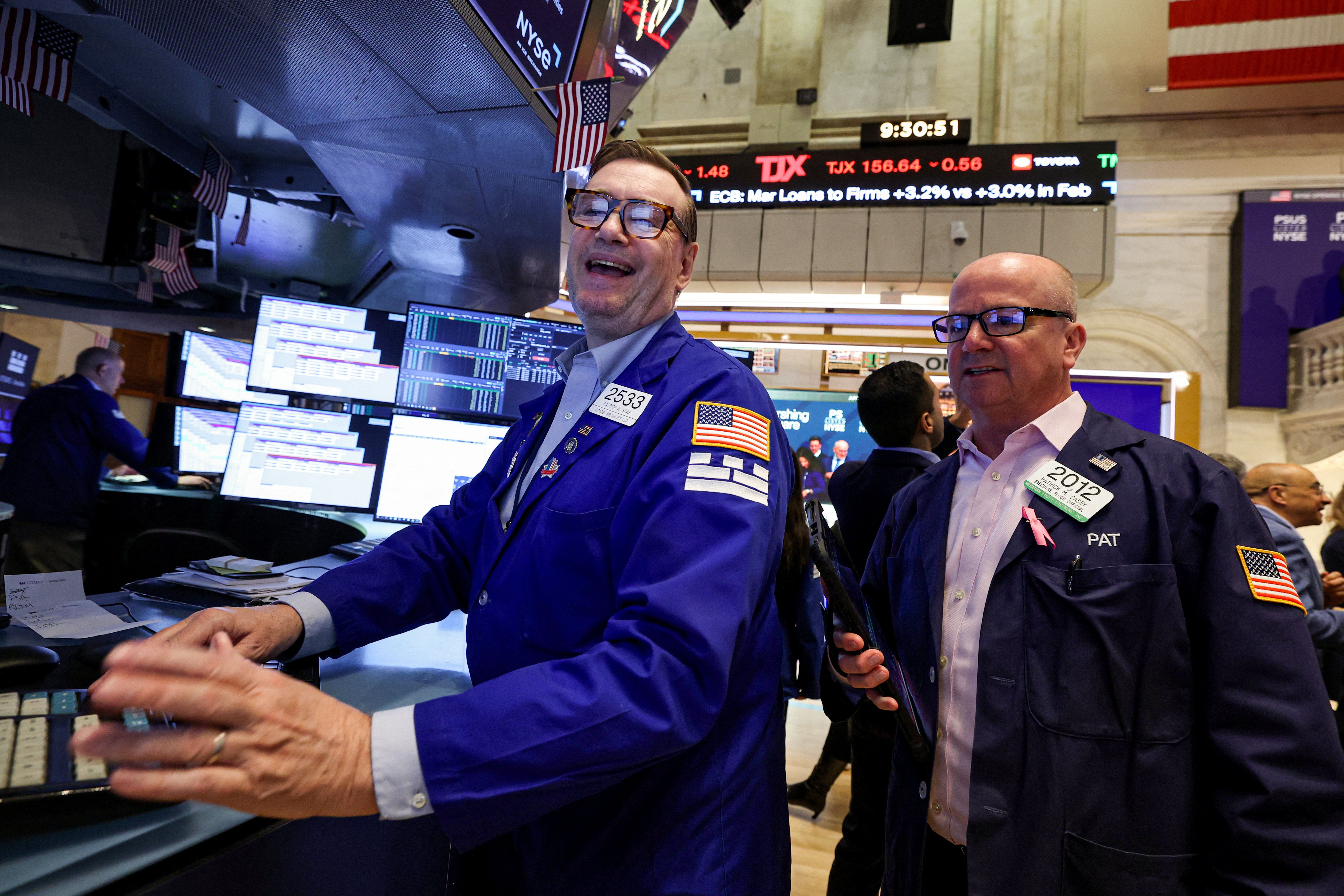 Traders work on the floor at the New York Stock Exchange