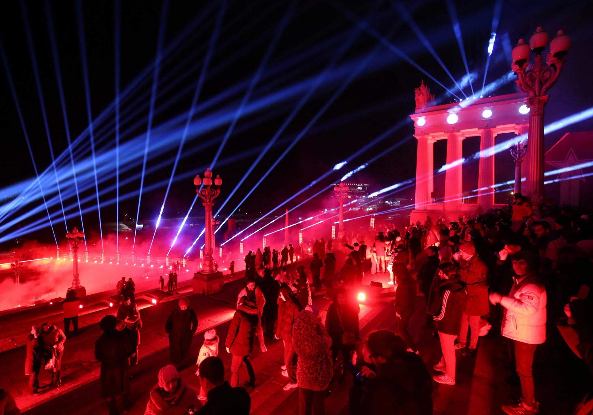 People watch a ceremony to mark the 80th anniversary of Soviet victory in the Battle of Stalingrad, at an embankment of the Volga River in Volgograd