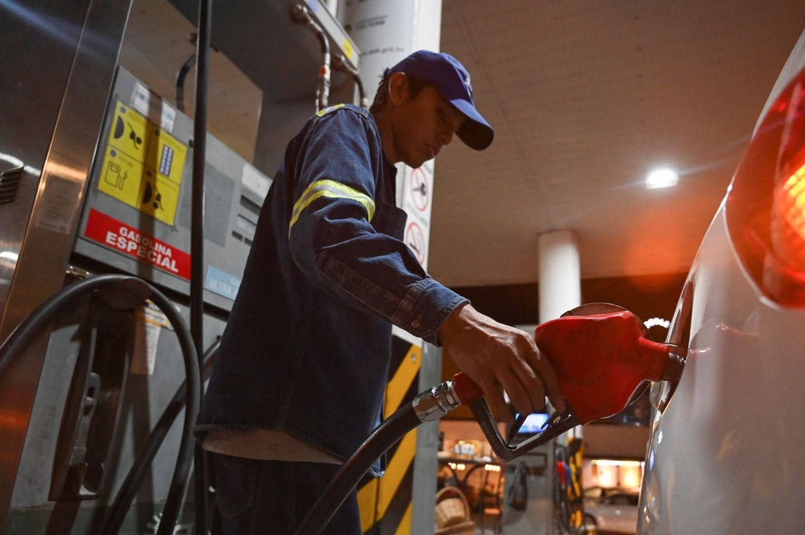 A person pumps gas in Bolivia