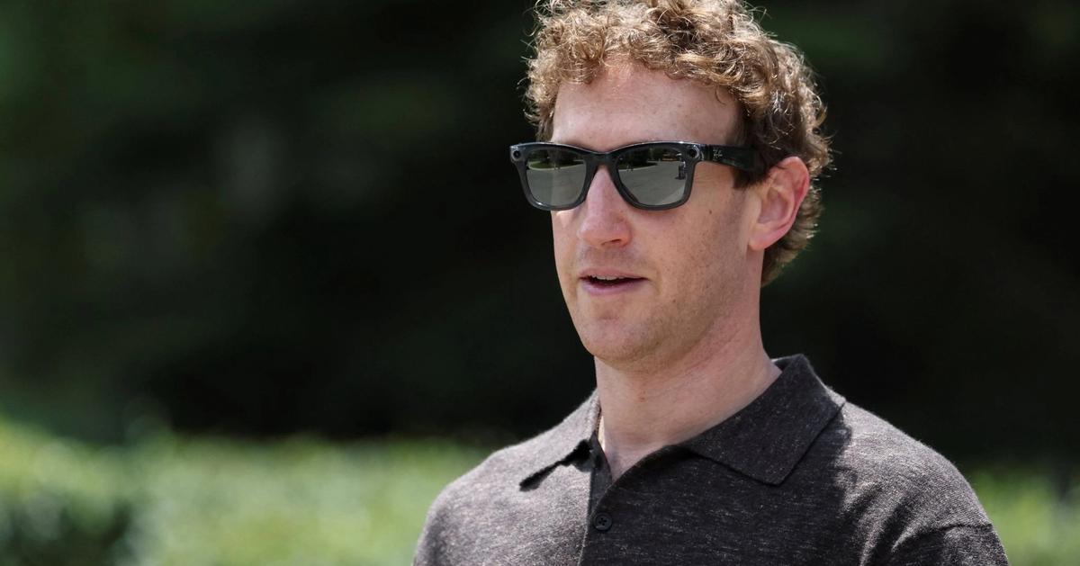 Meta CEO Mark Zuckerberg stands before a neutral background during a corporate event.
