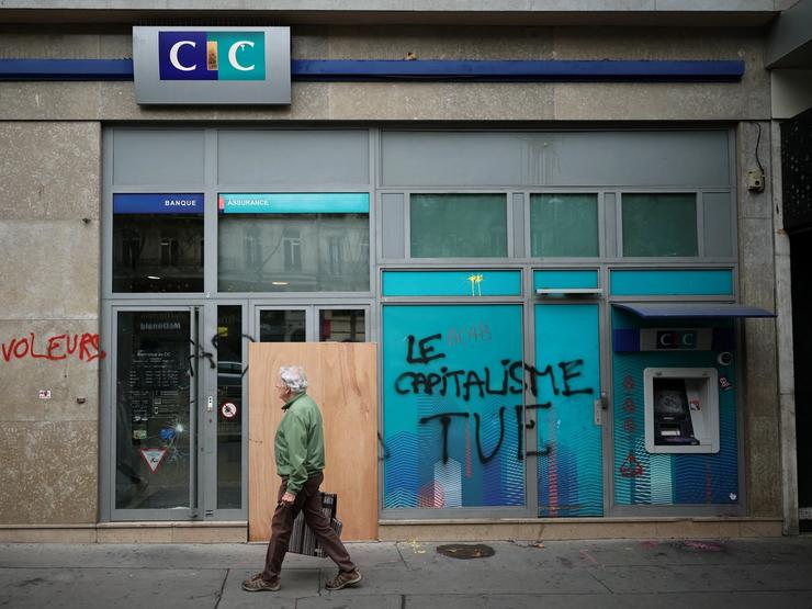 Graffiti outside of a bank in Paris, France