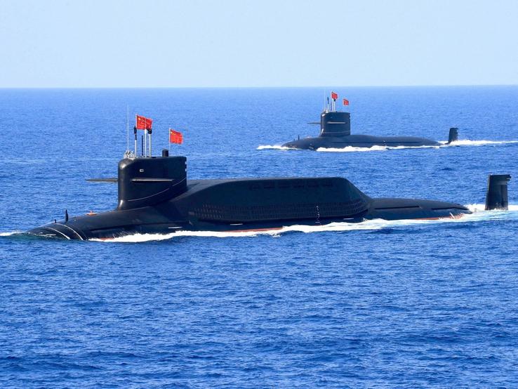 Chinese People’s Liberation Army Navy navigates during a military display in the South China Sea