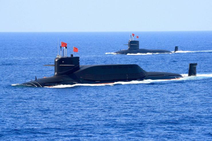 Chinese People’s Liberation Army Navy navigates during a military display in the South China Sea