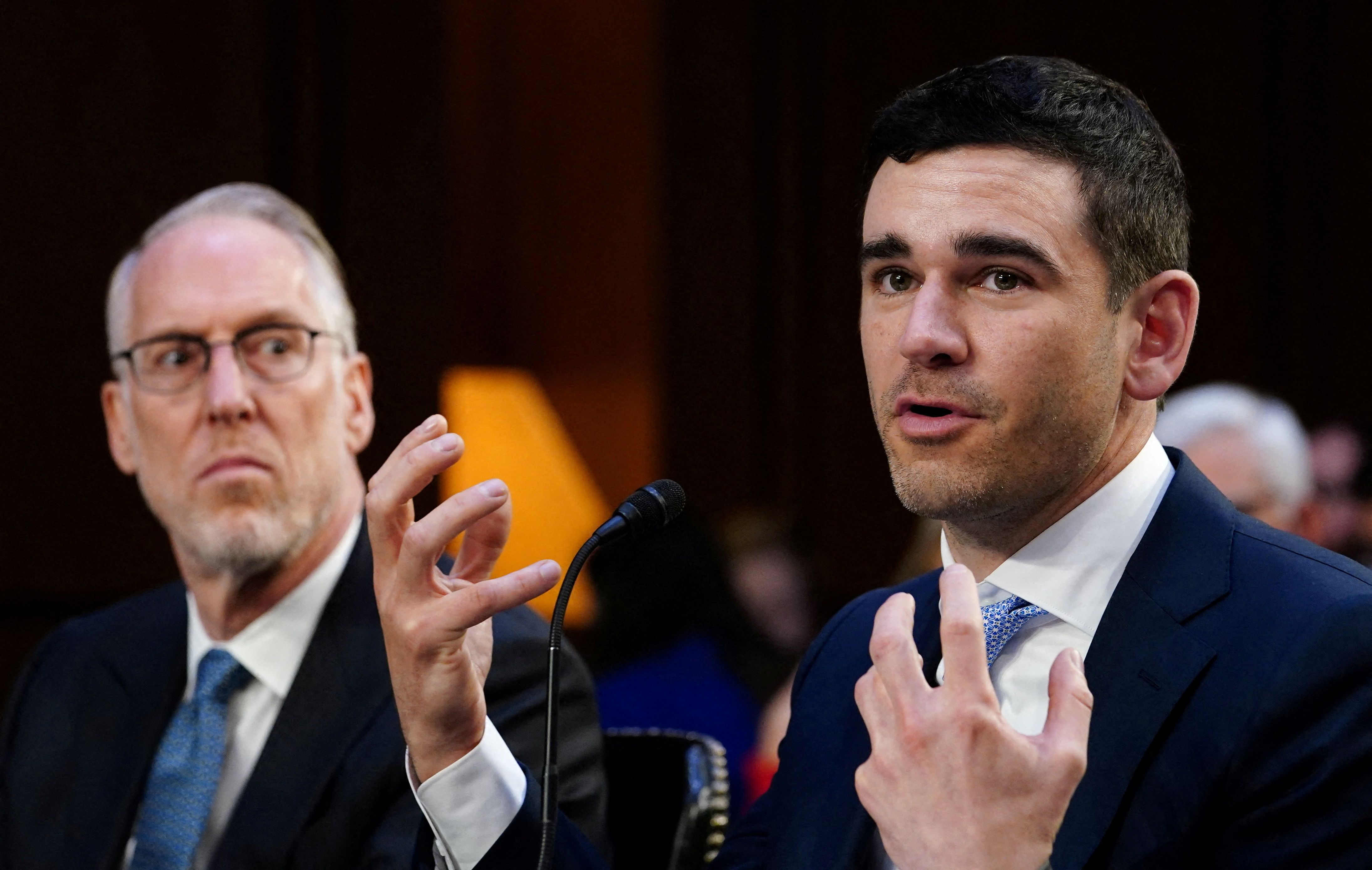 Live Nation Entertainment President and Chief Financial Officer Joe Berchtold listens as SeatGeek Chief Executive Officer Jack Groetzinger speaks during a Senate Judiciary Committee hearing titled “That’s the Ticket: Promoting Competition and Protecting Consumers in Live Entertainment” on Capitol Hill in Washington, U.S., January 24, 2023. REUTERS/Kevin Lamarque/File Photo