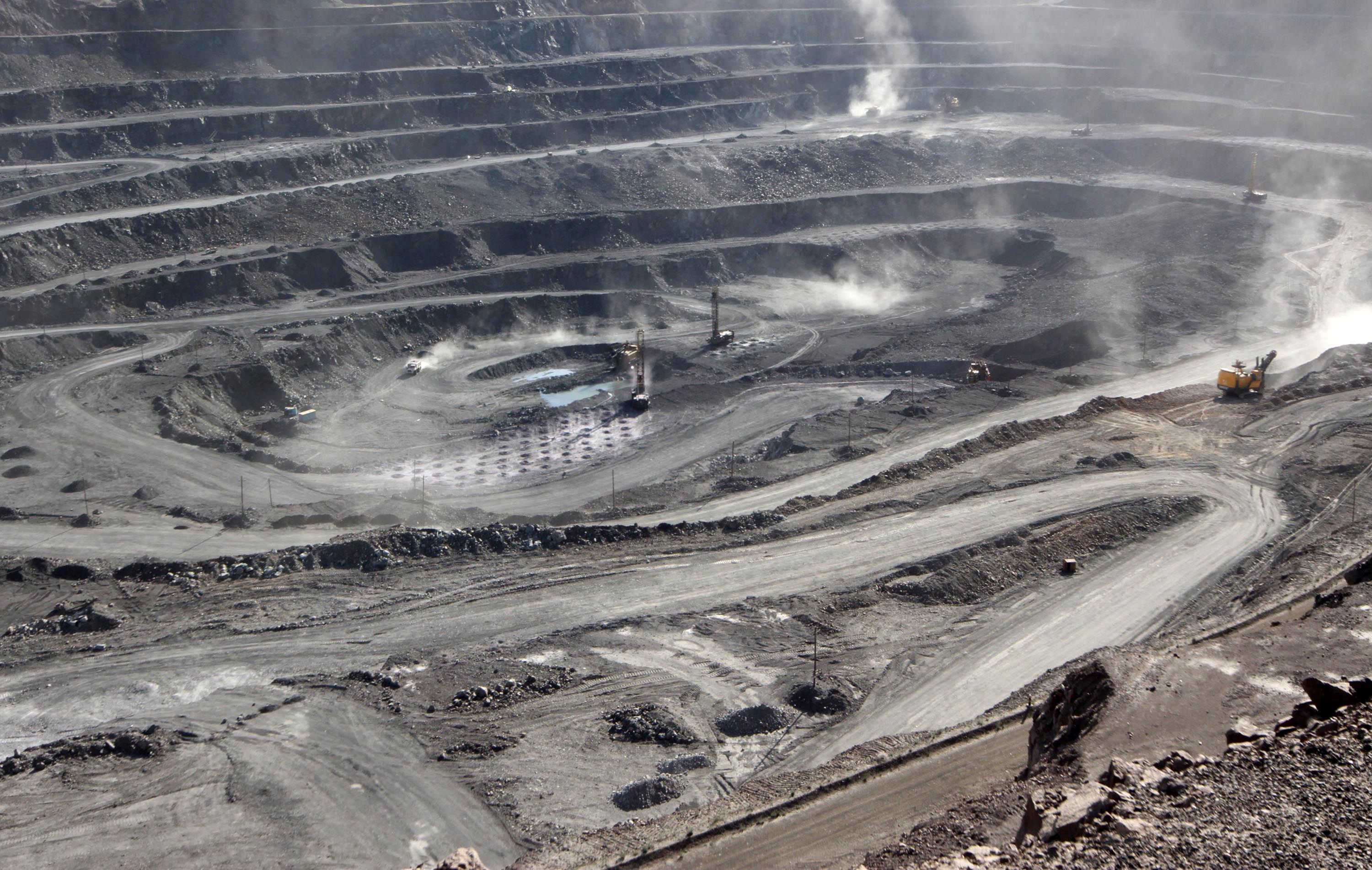 Miners are seen at the Bayan Obo mine containing rare earth minerals, in Inner Mongolia.