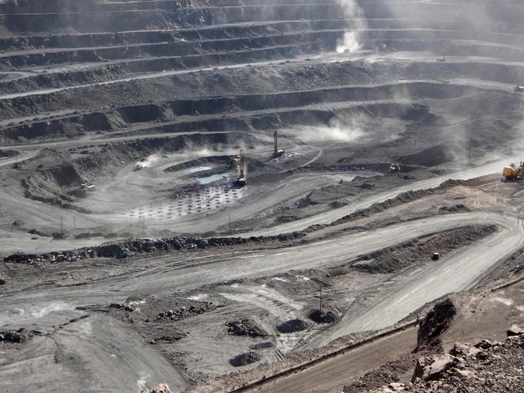 Miners are seen at the Bayan Obo mine containing rare earth minerals, in Inner Mongolia, China.