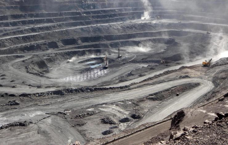 Miners are seen at the Bayan Obo mine containing rare earth minerals, in Inner Mongolia.