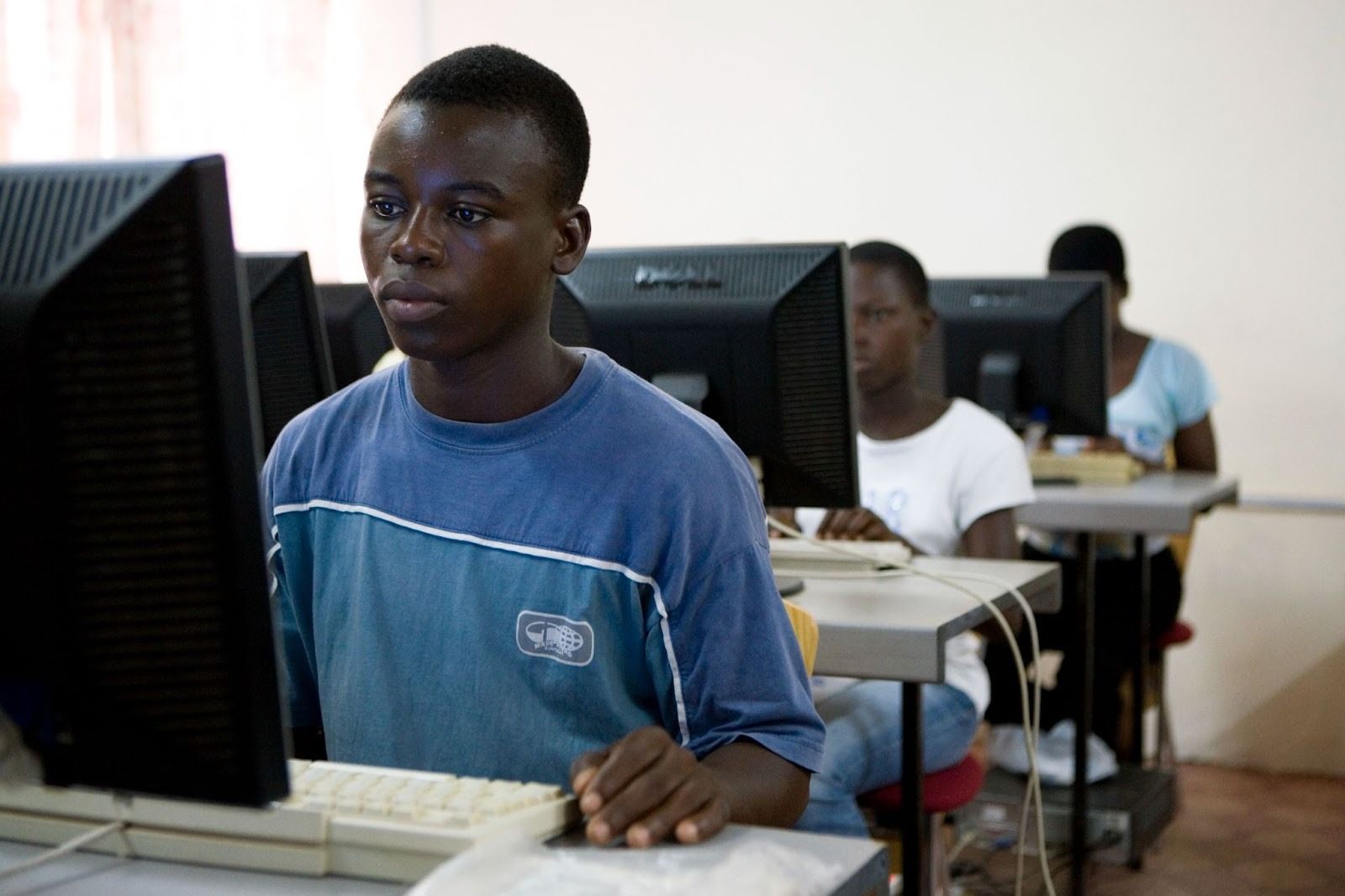Children from northern Ghana learn on computers.
