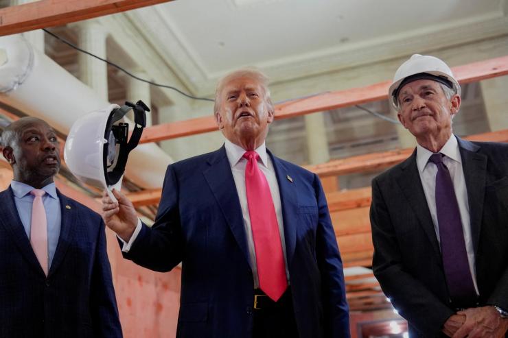 U.S. President Donald Trump, next to U.S. Senator Tim Scott (R-SC) and Federal Reserve Chair Jerome Powell.