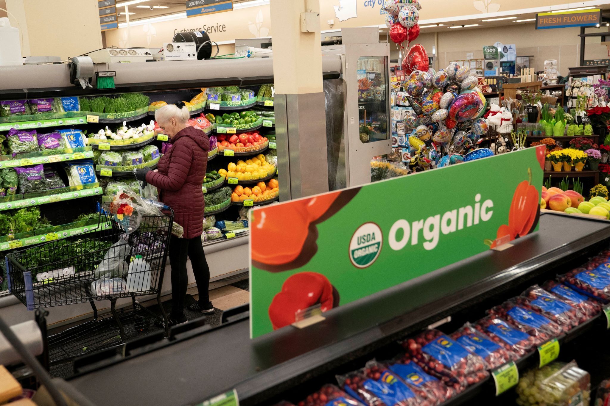 A food shopper browses for groceries at an Albertsons supermarket in Redmond, Washington