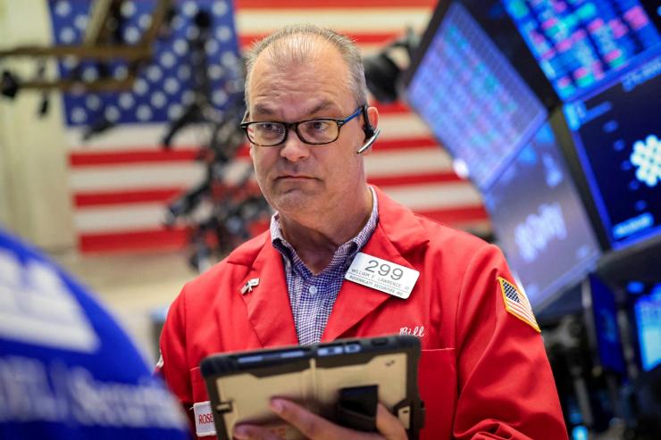 Traders work on the floor at the New York Stock Exchange (NYSE) in New York City.