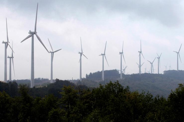 Power-generating windmill turbines form a wind farm on Backbone Mountain near Thomas, West Virginia