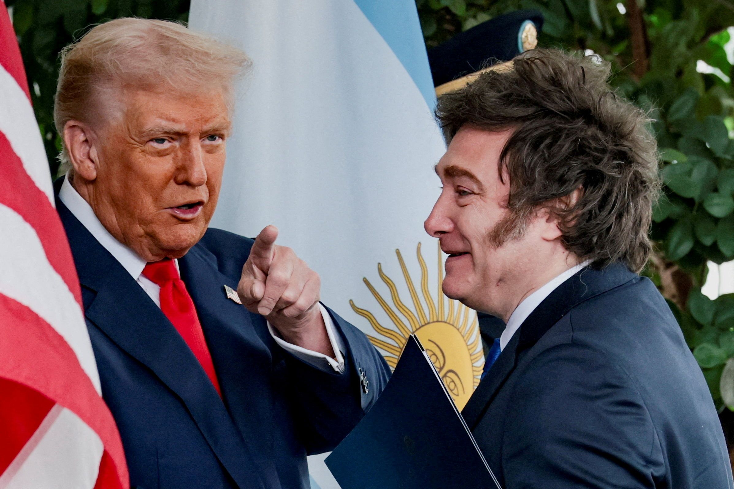 U.S. President Donald Trump points a finger as he welcomes Argentina’s President Javier Milei at the White House.