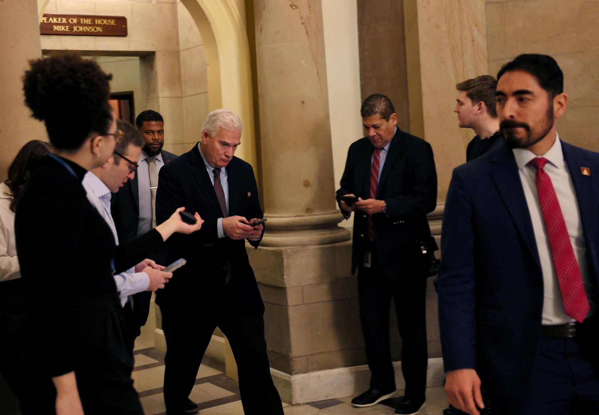 Members of the media approach US House Majority Whip Tom Emmer as he leaves US Speaker Mike Johnson’s office.