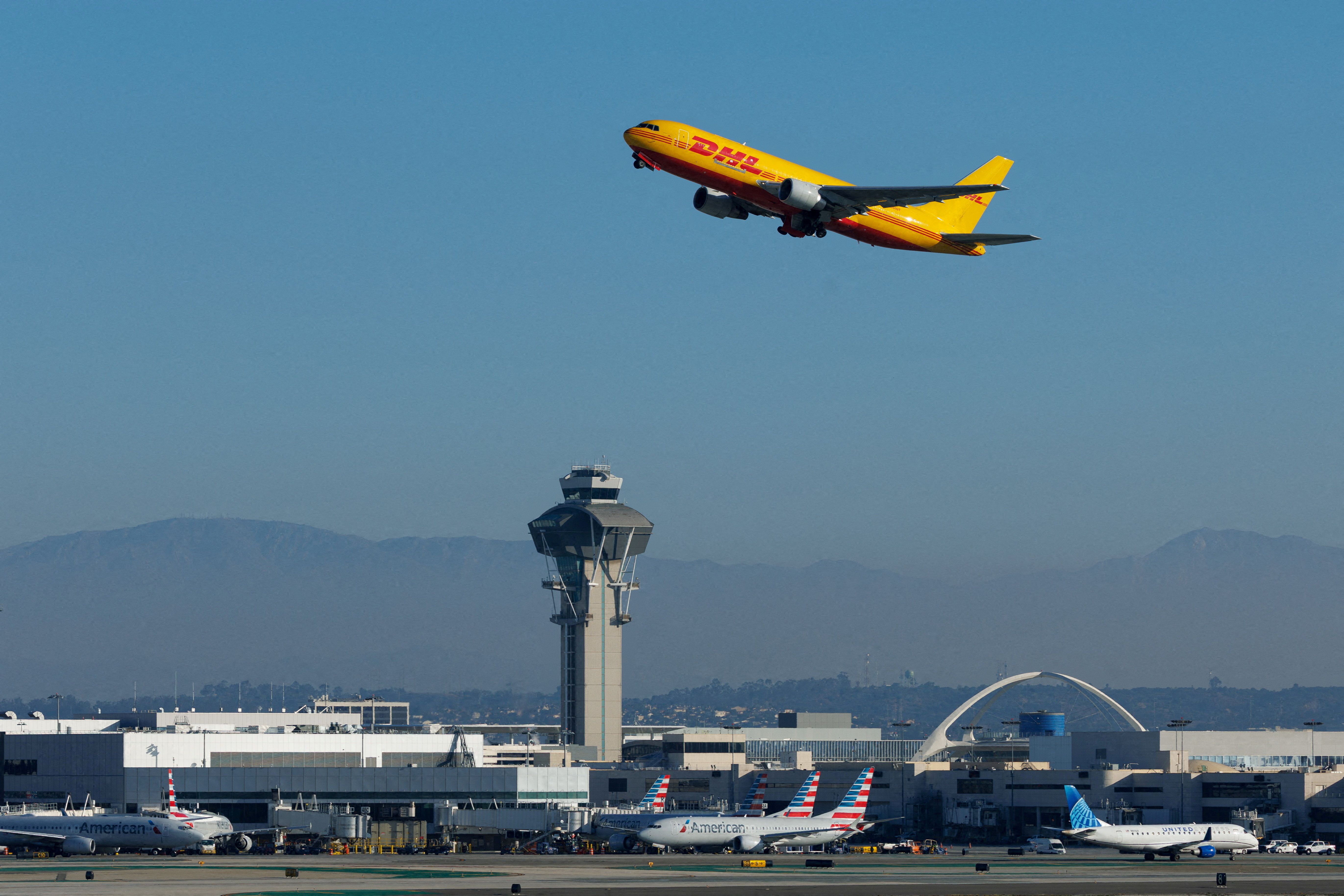 A DHL cargo plane takes-off from Los Angeles International Airport in Los Angeles, California