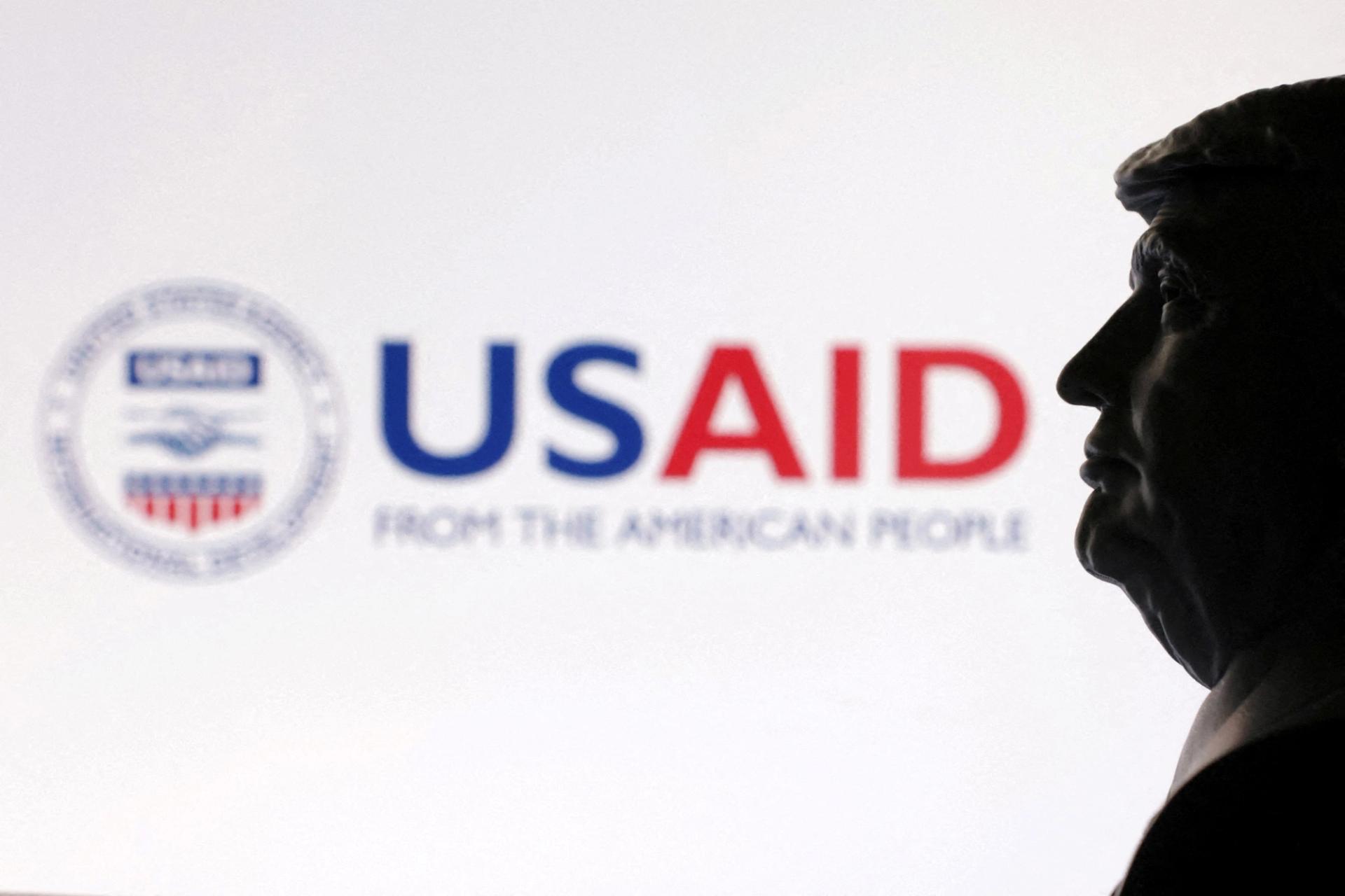 A 3D-printed miniature model of US. President Donald Trump with the USAID logo