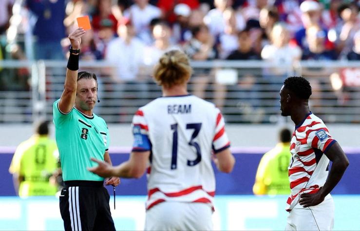 Folarin Balogun of the US is shown a red card