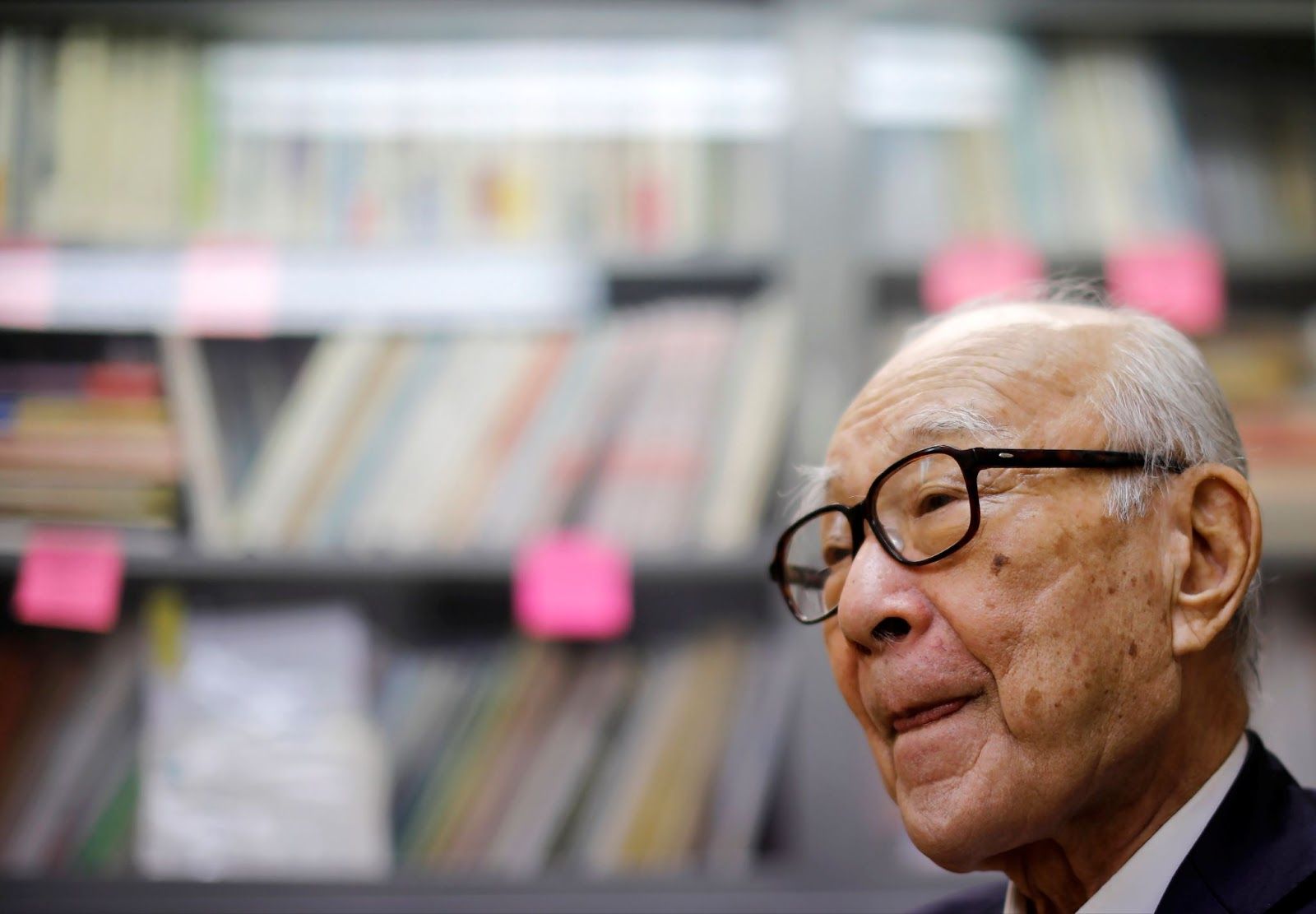 Terumi Tanaka, a balding man with white hair and dark glasses. 