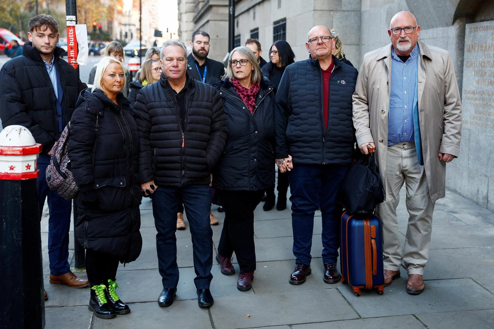 Harry Dunn's mother, Charlotte Charles and her husband Bruce stand with Harry Dunn's father, Tim Dunn, his partner Tracey and Radd Seiger, their adviser and spokesperson, as they attend the Old Bailey for the sentencing of Anne Sacoolas, the wife of a U.S. diplomat, over the death of Harry Dunn in a road traffic collision, in London, Britain, December 8, 2022.