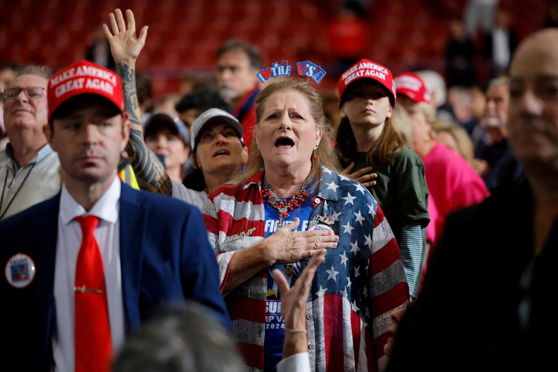 Trump supporters sing the US national anthem at a rally in North Carolina