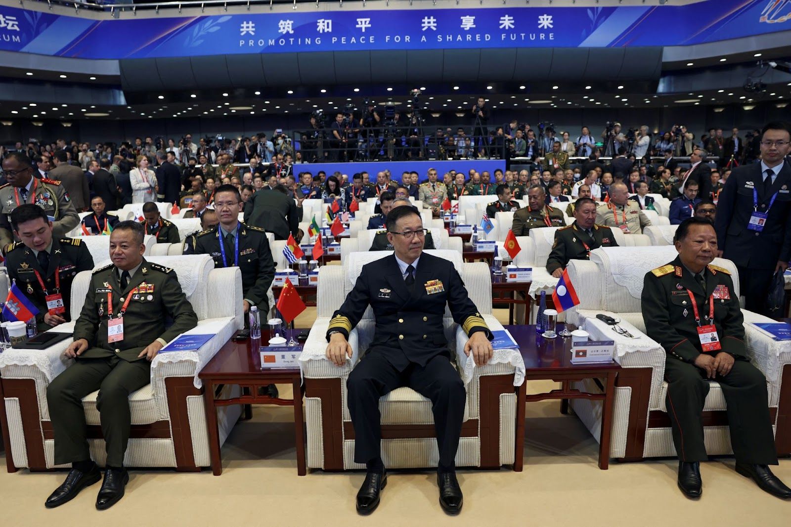 China’s defense minister, center