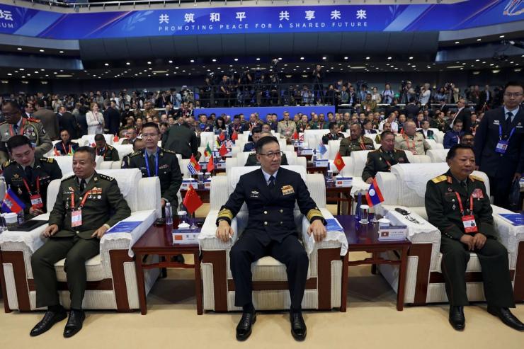 China’s defense minister, center