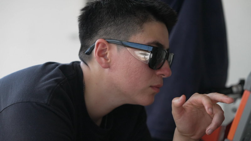 Apprentice Jen Peterson inspects Relativity Space’s Delta Qual engine at Stennis Space Center