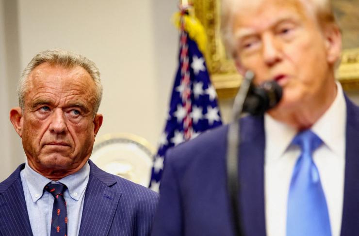 US Secretary of Health and Human Services Robert F. Kennedy Jr. looks at US President Donald Trump while he makes an announcement linking autism to childhood vaccines.